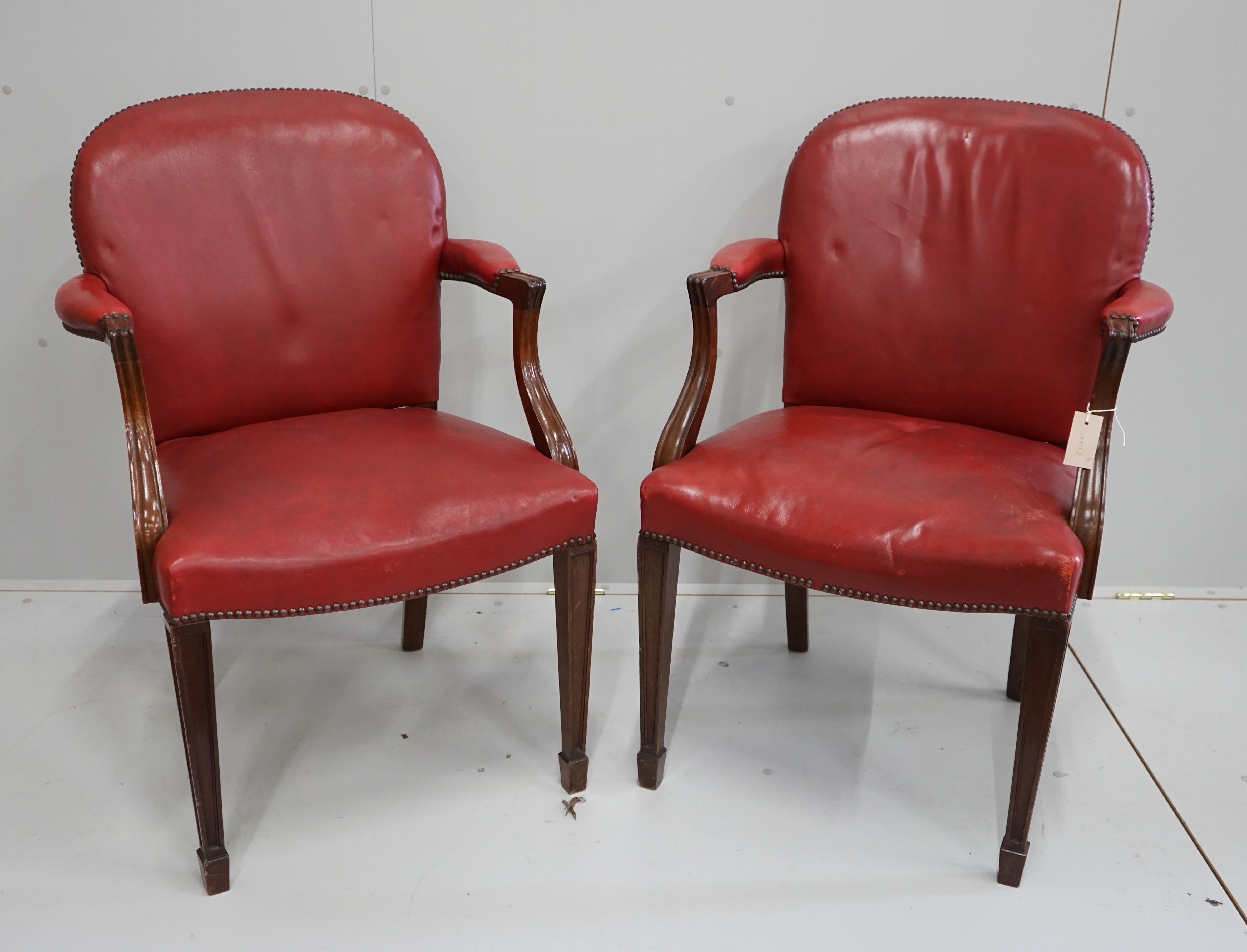 A pair of early 20th century elbow chairs, width 63cm, depth 52cm, height 94cm